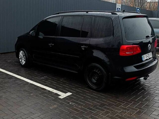 Черный Фольксваген Туран, объемом двигателя 1.4 л и пробегом 200 тыс. км за 10500 $, фото 1 на Automoto.ua