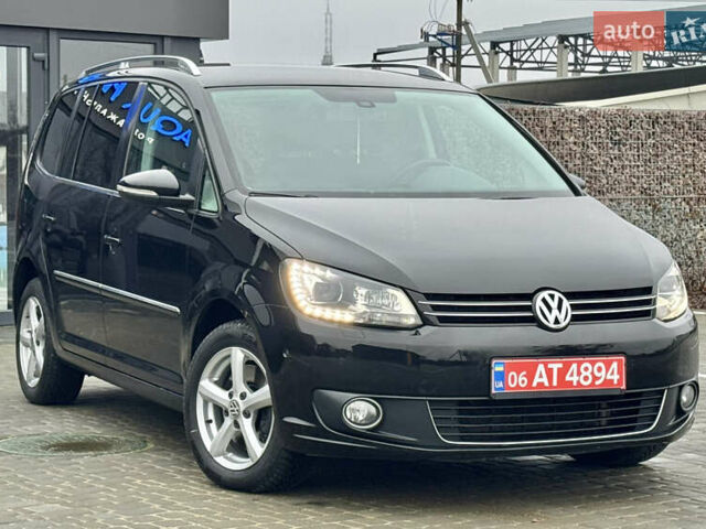 Черный Фольксваген Туран, объемом двигателя 2 л и пробегом 196 тыс. км за 14599 $, фото 1 на Automoto.ua