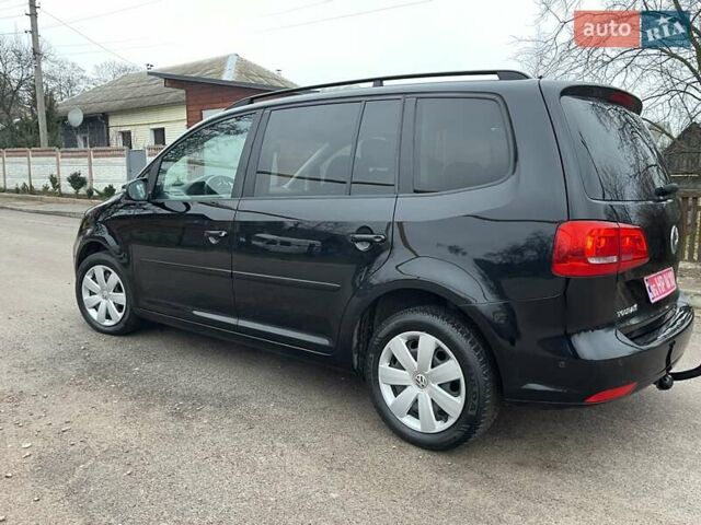 Черный Фольксваген Туран, объемом двигателя 1.4 л и пробегом 207 тыс. км за 10777 $, фото 177 на Automoto.ua