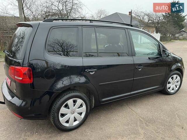 Черный Фольксваген Туран, объемом двигателя 1.4 л и пробегом 207 тыс. км за 10777 $, фото 169 на Automoto.ua