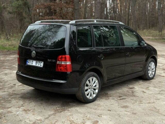Чорний Фольксваген Туран, об'ємом двигуна 2 л та пробігом 328 тис. км за 2999 $, фото 4 на Automoto.ua