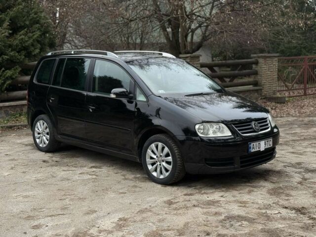 Чорний Фольксваген Туран, об'ємом двигуна 2 л та пробігом 328 тис. км за 2999 $, фото 2 на Automoto.ua