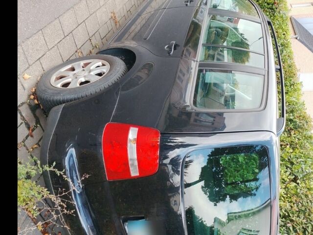 Черный Фольксваген Туран, объемом двигателя 1.6 л и пробегом 200 тыс. км за 4850 $, фото 2 на Automoto.ua