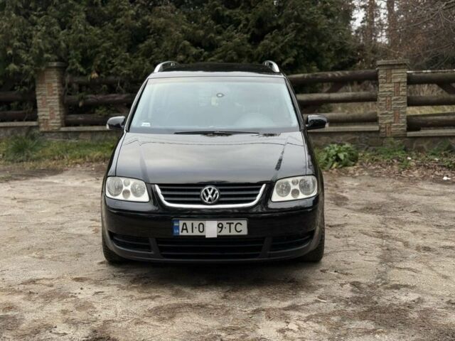 Чорний Фольксваген Туран, об'ємом двигуна 2 л та пробігом 328 тис. км за 2999 $, фото 1 на Automoto.ua