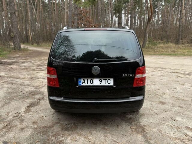 Чорний Фольксваген Туран, об'ємом двигуна 2 л та пробігом 328 тис. км за 2999 $, фото 5 на Automoto.ua