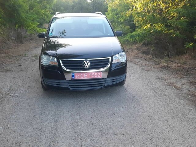 Черный Фольксваген Туран, объемом двигателя 1.6 л и пробегом 138 тыс. км за 7175 $, фото 1 на Automoto.ua