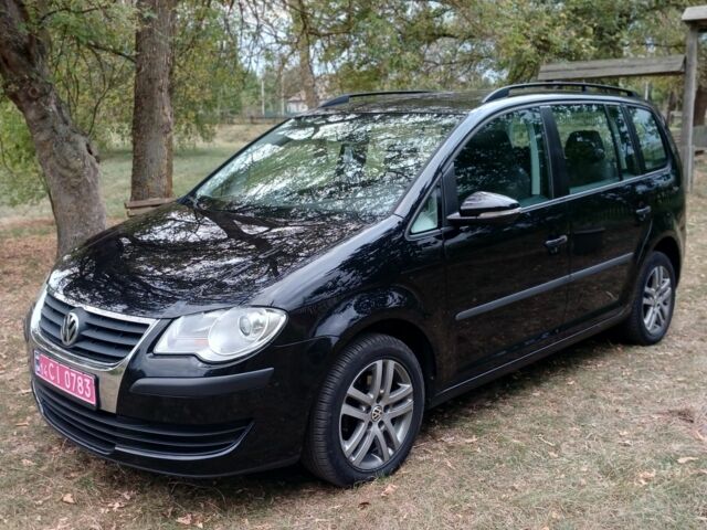 Черный Фольксваген Туран, объемом двигателя 1.6 л и пробегом 248 тыс. км за 8299 $, фото 1 на Automoto.ua