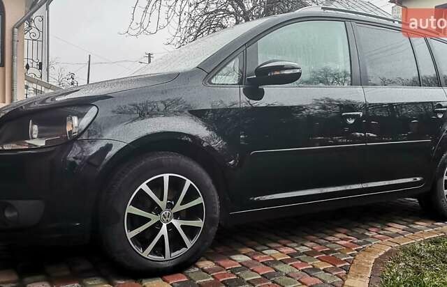 Черный Фольксваген Туран, объемом двигателя 1.6 л и пробегом 211 тыс. км за 12950 $, фото 1 на Automoto.ua