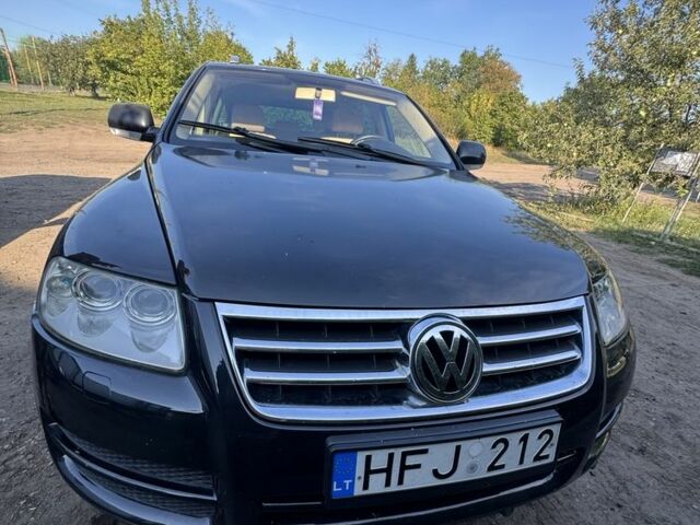 Черный Фольксваген Туран, объемом двигателя 2.5 л и пробегом 318 тыс. км за 4800 $, фото 2 на Automoto.ua
