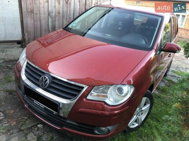 Червоний Фольксваген Туран, об'ємом двигуна 1.4 л та пробігом 241 тис. км за 7300 $, фото 1 на Automoto.ua