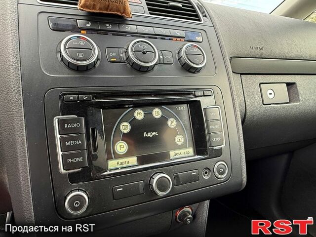 Фольксваген Туран 2013 в Вознесенске на Automoto.ua Фольксваген Туран, объемом двигателя 2 л и пробегом 179 тыс. км за 14500 $, фото 10 на Automoto.ua