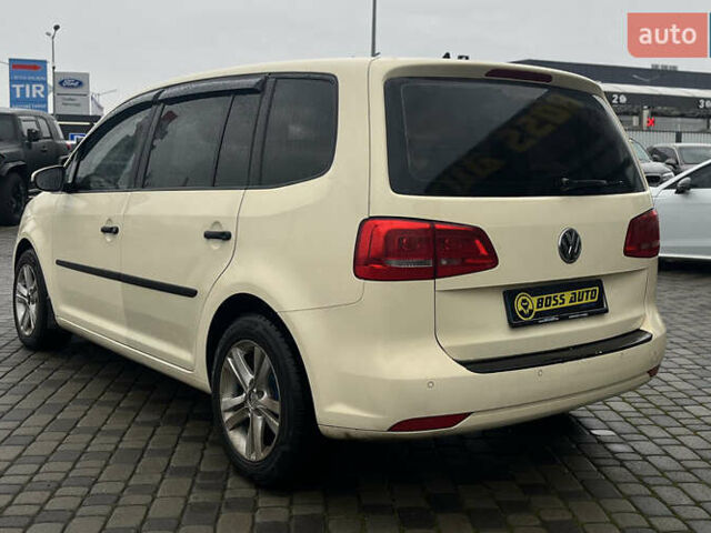 Желтый Фольксваген Туран, объемом двигателя 1.97 л и пробегом 213 тыс. км за 8990 $, фото 4 на Automoto.ua