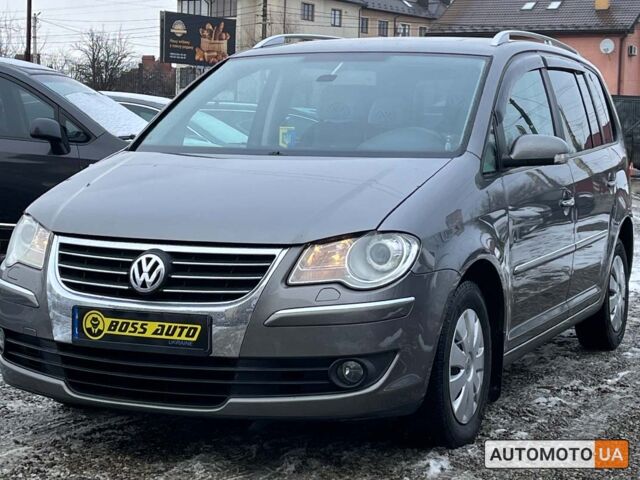 Серый Фольксваген Туран, объемом двигателя 1.4 л и пробегом 242 тыс. км за 7950 $, фото 2 на Automoto.ua