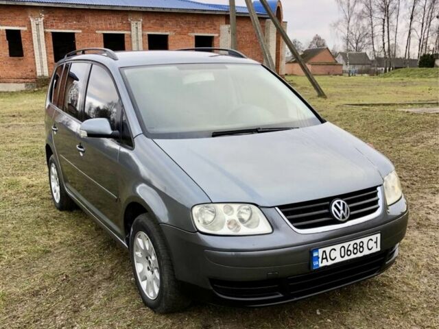 Серый Фольксваген Туран, объемом двигателя 2 л и пробегом 350 тыс. км за 5499 $, фото 1 на Automoto.ua