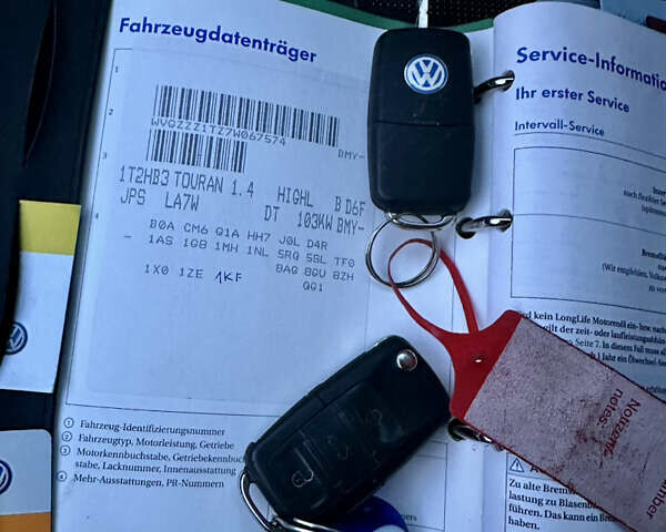 Сірий Фольксваген Туран, об'ємом двигуна 1.4 л та пробігом 248 тис. км за 7500 $, фото 48 на Automoto.ua