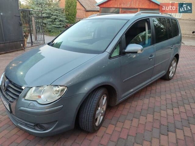 Сірий Фольксваген Туран, об'ємом двигуна 1.4 л та пробігом 246 тис. км за 6900 $, фото 2 на Automoto.ua