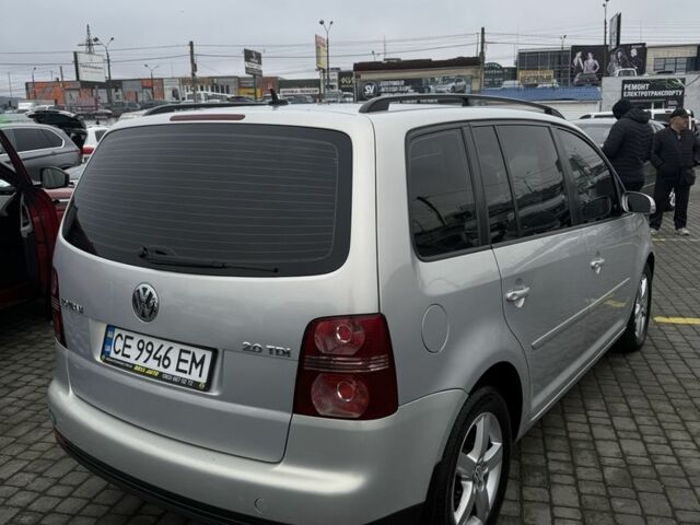 Серый Фольксваген Туран, объемом двигателя 2 л и пробегом 326 тыс. км за 7600 $, фото 2 на Automoto.ua