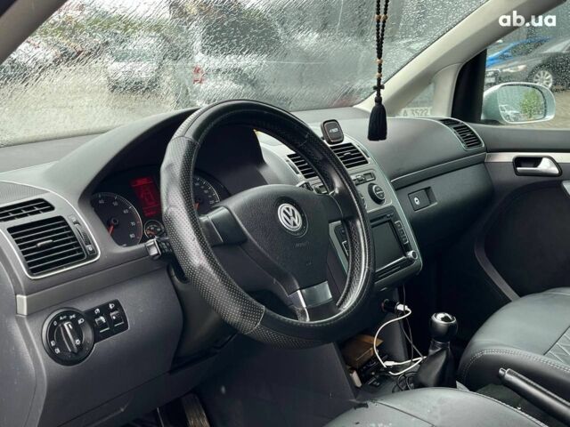 Серый Фольксваген Туран, объемом двигателя 1.4 л и пробегом 256 тыс. км за 7490 $, фото 23 на Automoto.ua