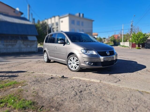 Серый Фольксваген Туран, объемом двигателя 1.4 л и пробегом 216 тыс. км за 4300 $, фото 1 на Automoto.ua