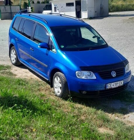 Синий Фольксваген Туран, объемом двигателя 1.6 л и пробегом 214 тыс. км за 5600 $, фото 1 на Automoto.ua