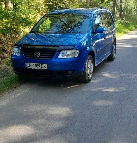 Синий Фольксваген Туран, объемом двигателя 1.6 л и пробегом 214 тыс. км за 5600 $, фото 7 на Automoto.ua