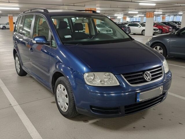 Синий Фольксваген Туран, объемом двигателя 2 л и пробегом 280 тыс. км за 3500 $, фото 1 на Automoto.ua