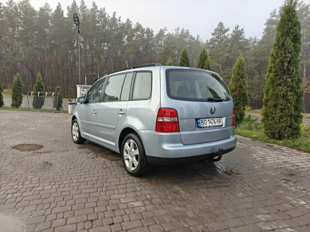 Синий Фольксваген Туран, объемом двигателя 1.6 л и пробегом 205 тыс. км за 5950 $, фото 2 на Automoto.ua