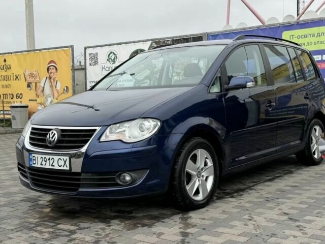 Синий Фольксваген Туран, объемом двигателя 1.4 л и пробегом 203 тыс. км за 7822 $, фото 1 на Automoto.ua