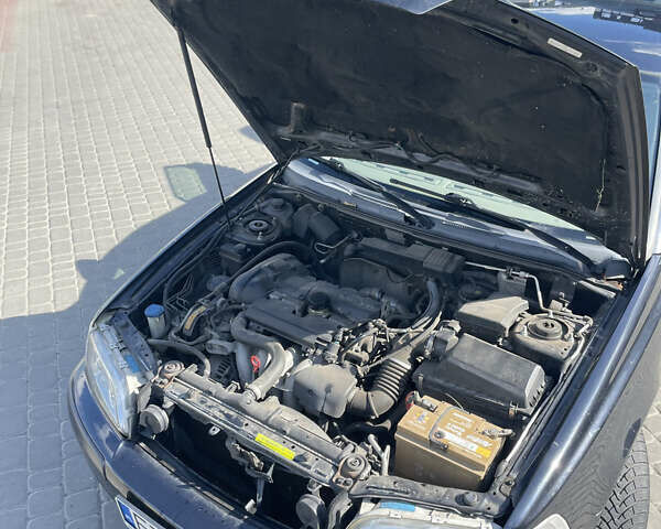 Черный Вольво В40, объемом двигателя 1.8 л и пробегом 275 тыс. км за 3800 $, фото 1 на Automoto.ua