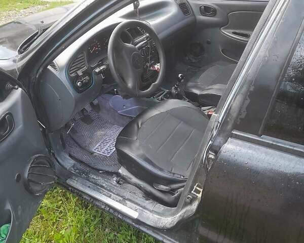 Черный ЗАЗ Ланос, объемом двигателя 1.5 л и пробегом 200 тыс. км за 1700 $, фото 1 на Automoto.ua