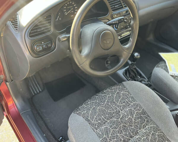 Красный ЗАЗ Ланос, объемом двигателя 1.39 л и пробегом 227 тыс. км за 1600 $, фото 7 на Automoto.ua