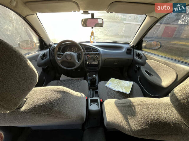 Красный ЗАЗ Ланос, объемом двигателя 1.39 л и пробегом 227 тыс. км за 1600 $, фото 14 на Automoto.ua