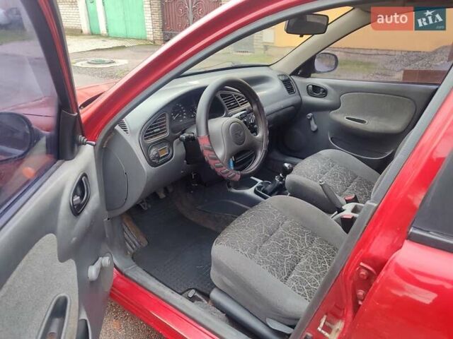 Красный ЗАЗ Ланос, объемом двигателя 1.39 л и пробегом 254 тыс. км за 1500 $, фото 7 на Automoto.ua