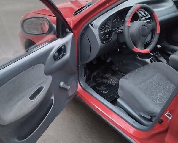 Красный ЗАЗ Ланос, объемом двигателя 1.4 л и пробегом 198 тыс. км за 1750 $, фото 7 на Automoto.ua