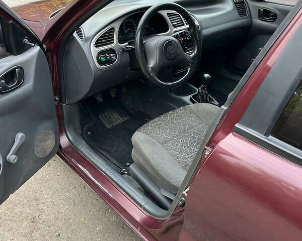 Красный ЗАЗ Ланос, объемом двигателя 1.39 л и пробегом 123 тыс. км за 3000 $, фото 8 на Automoto.ua