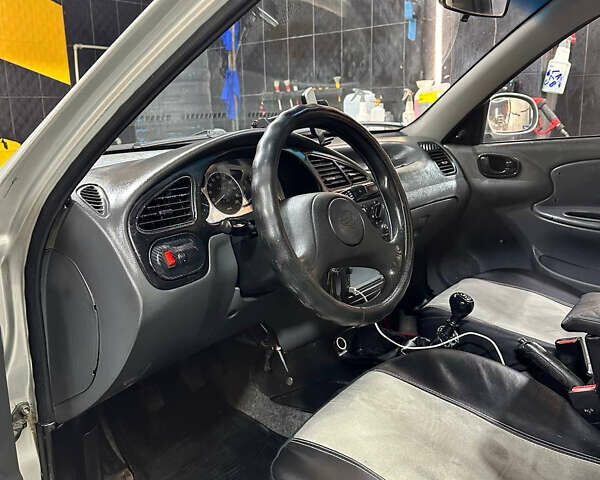 Сірий ЗАЗ Ланос, об'ємом двигуна 1.6 л та пробігом 270 тис. км за 1999 $, фото 20 на Automoto.ua