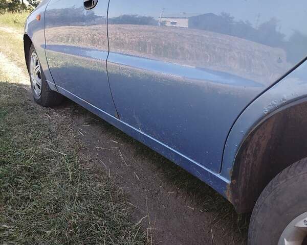 Синій ЗАЗ Ланос, об'ємом двигуна 1.39 л та пробігом 180 тис. км за 2150 $, фото 10 на Automoto.ua