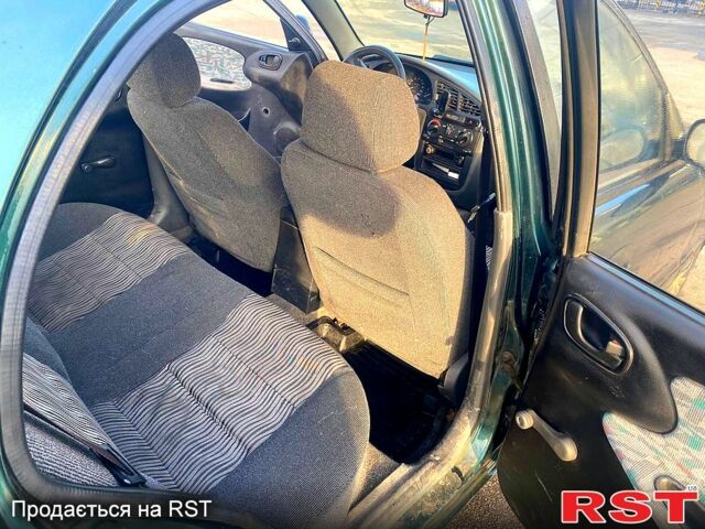 Зеленый ЗАЗ Ланос, объемом двигателя 1.5 л и пробегом 230 тыс. км за 2100 $, фото 6 на Automoto.ua