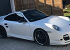 Белый Порше 911, объемом двигателя 3.6 л и пробегом 97 тыс. км за 101408 $, фото 1 на Automoto.ua