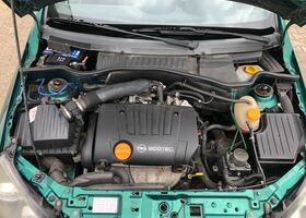 Зелений Опель Тігра, об'ємом двигуна 1.8 л та пробігом 164 тис. км за 4103 $, фото 8 на Automoto.ua