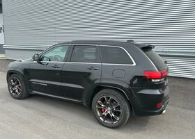 Чорний Джип Grand Cherokee, об'ємом двигуна 6.42 л та пробігом 165 тис. км за 39903 $, фото 4 на Automoto.ua