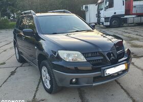 Мицубиси Аутлендер 2005 в Европе на Automoto.ua Черный Мицубиси Аутлендер, объемом двигателя 1 л и пробегом 227 тыс. км за 15900 $, фото 14 на Automoto.ua