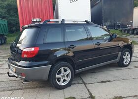 Мицубиси Аутлендер 2005 в Европе на Automoto.ua Черный Мицубиси Аутлендер, объемом двигателя 1 л и пробегом 227 тыс. км за 15900 $, фото 2 на Automoto.ua
