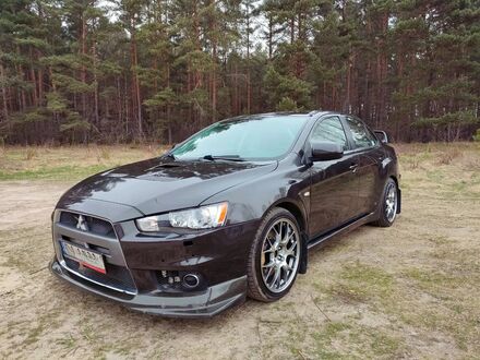 Міцубісі Лансер Еволюшн 2009 у Європі на Automoto.ua Чорний Міцубісі Лансер Еволюшн, об'ємом двигуна 2 л та пробігом 114577 тис. км за 99000 $, фото 1 на Automoto.ua