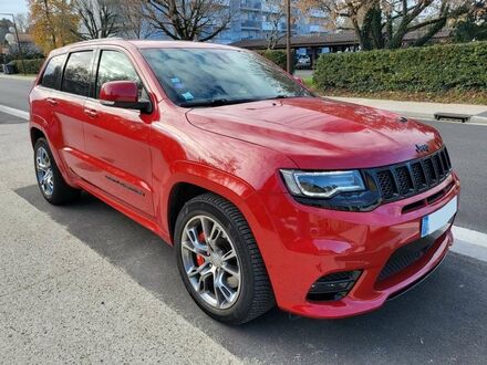 Червоний Джип Grand Cherokee, об'ємом двигуна 6.42 л та пробігом 47 тис. км за 68393 $, фото 1 на Automoto.ua