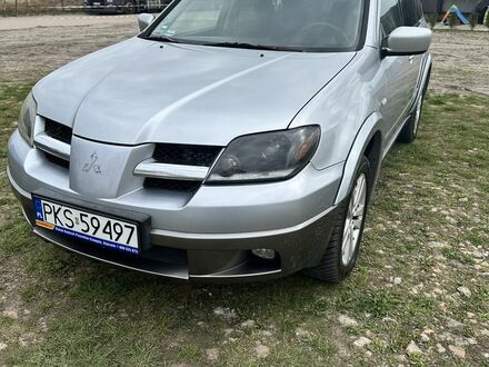 Мицубиси Аутлендер 2004 в Европе на Automoto.ua Серый Мицубиси Аутлендер, объемом двигателя 2.38 л и пробегом 247 тыс. км за 12000 $, фото 1 на Automoto.ua