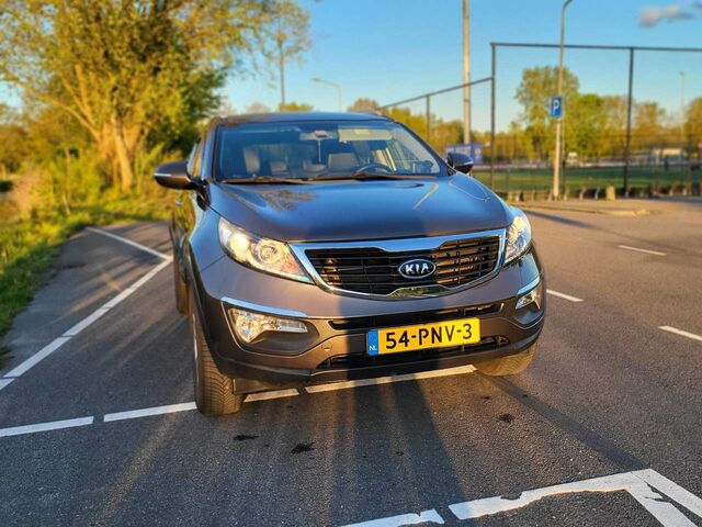 Коричневий Кіа Sportage, об'ємом двигуна 2 л та пробігом 82 тис. км за 13985 $, фото 1 на Automoto.ua