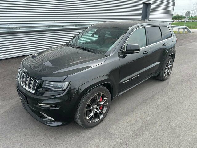 Чорний Джип Grand Cherokee, об'ємом двигуна 6.42 л та пробігом 165 тис. км за 39903 $, фото 1 на Automoto.ua