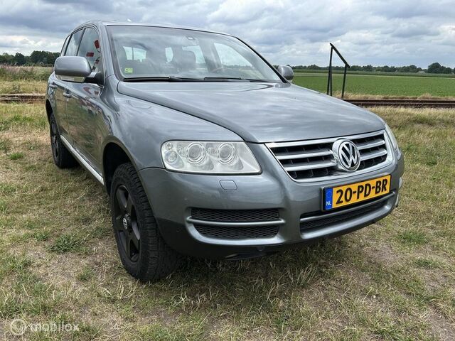 Фольксваген Туарег 2004 у Європі на Automoto.ua Сірий Фольксваген Туарег, об'ємом двигуна 3.19 л та пробігом 282 тис. км за 4113 $, фото 1 на Automoto.ua