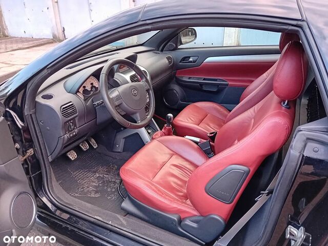 Опель Тигра 2008 в Европе на Automoto.ua Черный Опель Тигра, объемом двигателя 1 л и пробегом 226 тыс. км за 17500 $, фото 12 на Automoto.ua